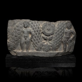 A Gandharan Grey Schist Relief of Garland Bearers, 2nd-3rd Century