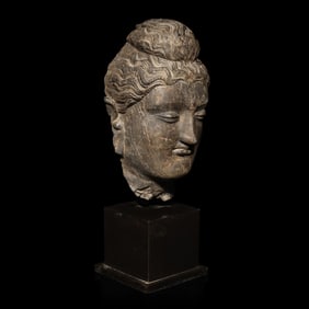 A Gandharan Grey Schist Head of Buddha, 3rd/4th Century