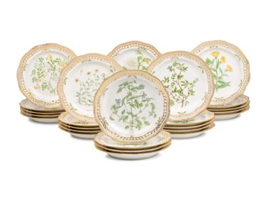 A Set of Twenty-Nine Royal Copenhagen Flora Danica Reticulated Porcelain Dinner Plates