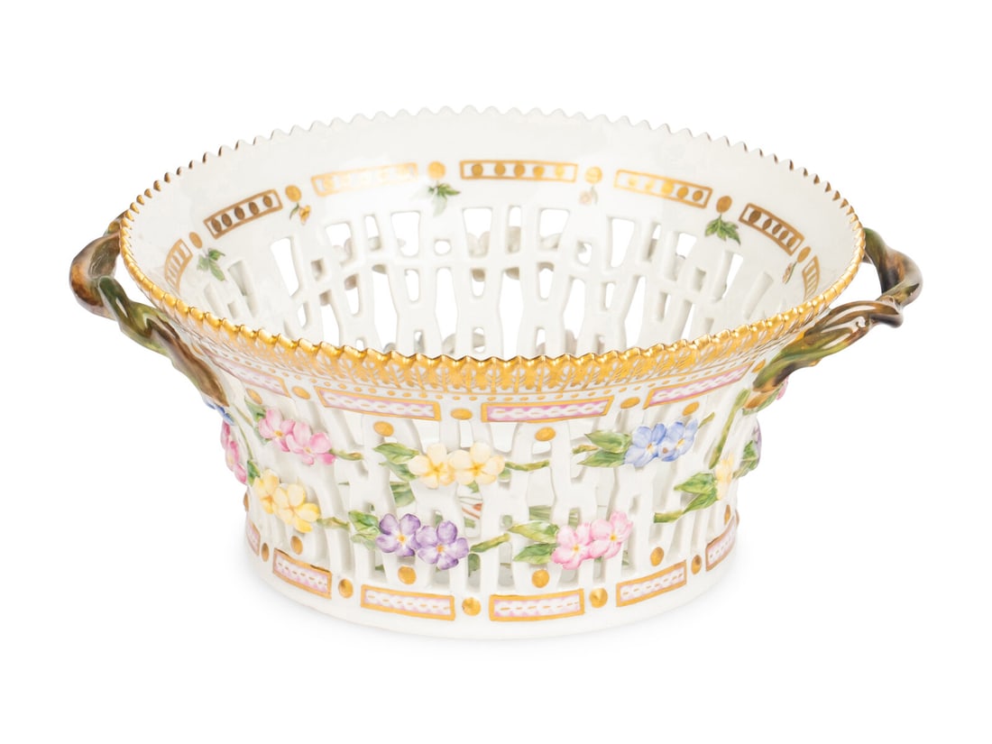 A Royal Copenhagen Flora Danica Porcelain Reticulated Bowl: A Royal Copenhagen Flora Danica Porcelain Reticulated Bowl 20th Century with crown and three wave marks to underside. Width over handles 8 1/2 inches. Property of a California Collector This lot is lo