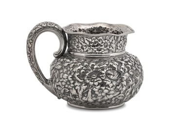 An American Silver Floral Repoussé Water Pitcher