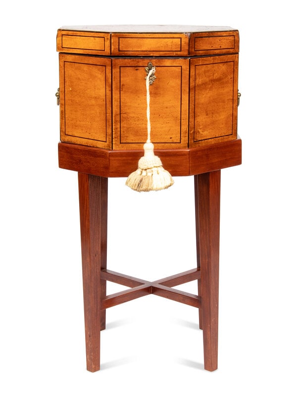 An English Mahogany and Paint-Decorated Cellarette: An English Mahogany and Paint-Decorated Cellarette 19th Century Cellarette height 7 1/4 x width 11 1/4 inches. With stand, height 22 1/4 inches. Property from a Private Collection