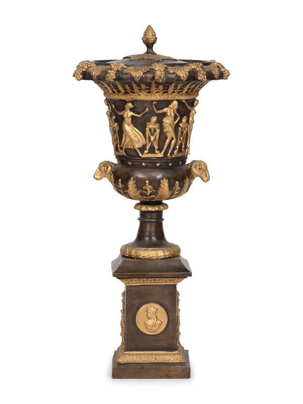 An Empire Style Cast Bronze Parcel Gilt Lidded Campagna Urn : An Empire Style Cast Bronze Parcel Gilt Lidded Campagna Urn 20th Century Height 32 x diameter 15 inches. This lot is located in Palm Beach.