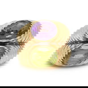 AMETHYST, PERIDOT, AND YELLOW GOLD RING: AMETHYST, PERIDOT, AND YELLOW GOLD RING Oval amethyst measuring approximately 9.70 x 7.70 x 5.45 mm, and oval peridot measuring approximately 10.10 x 7.80 x 5.35 mm. Yellow gold. Ring size 6. Gross
