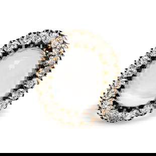 MOONSTONE AND DIAMOND RING: MOONSTONE AND DIAMOND RING Oval cabochon moonstone measuring approximately 18.55 x 14.80 x 9.10 mm and round diamonds weighing approximately 2.00 carats total. Yellow gold. Ring size 9 3/4. Gross weig
