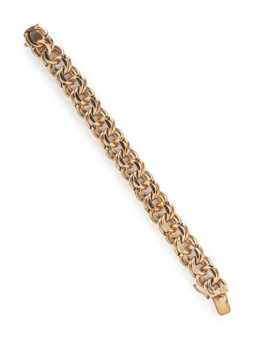 YELLOW GOLD BRACELET: YELLOW GOLD BRACELET 14 karat yellow gold. 7 1/2 inches long, 15.00 mm wide. Stamp: 14K. Gross weight: 50.00 dwt. Jewelry from the Private Collection of an Artist