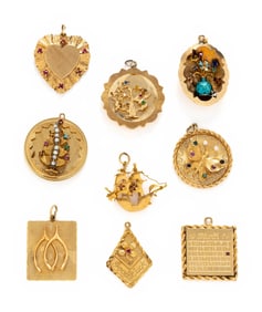 COLLECTION OF YELLOW GOLD CHARMS