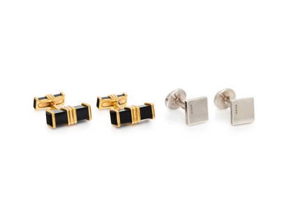 TWO PAIRS OF SIGNED CUFFLINKS: TWO PAIRS OF SIGNED CUFFLINKS Including a pair of sterling silver Gucci cufflinks, and a pair of 18 karat yellow gold and black onyx Chaumet cufflinks. 1/2 - 3/4 inch wide. Square cufflinks stamp: GUC