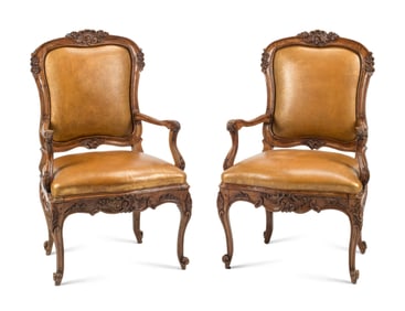 A Pair of French Provincial Carved Walnut Armchairs