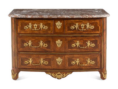 A Régence Gilt Bronze Mounted Walnut Parquetry Commode: A Régence Gilt Bronze Mounted Walnut Parquetry Commode Second Quarter 18th Century with a liver marble top. Height 33 x width 50 1/2 x depth 24 inches. Property of a California Collector This lot