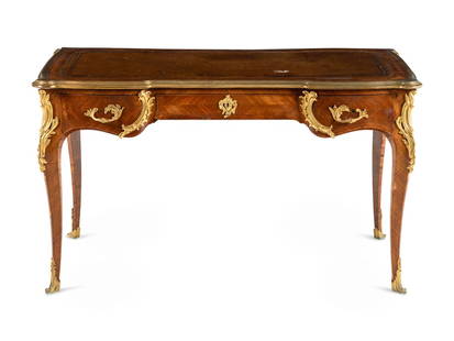 A Louis XV Style Gilt Bronze Mounted Parquetry Bureau Plat: A Louis XV Style Gilt Bronze Mounted Parquetry Bureau Plat 19th Century having a tooled leather writing surface. Height 29 1/2 x width 51 1/2 x depth 30 inches. This lot is located in Chicago.