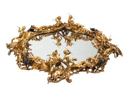 A Louis XV Style Gilt and Patinated Bronze Surtout de Table: A Louis XV Style Gilt and Patinated Bronze Surtout de Table 20th Century Height 7 x diameter 35 inches. This lot is located in Chicago.