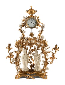 A Louis XV Style Porcelain Mounted Gilt Bronze Clock