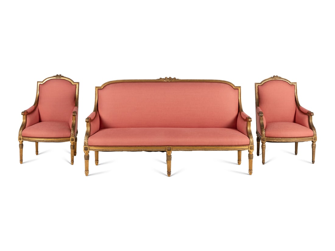 A Louis XVI Style Giltwood Three-Piece Seating Suite: A Louis XVI Style Giltwood Three-Piece Seating Suite 19th/20th Century comprising a settee and two bergères. Height of settee 40 x width 73 x depth 23 inches; height of bergère 40 x width 25