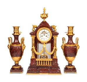 A Louis XVI Style Rouge Marble and Gilt Bronze Clock Garniture