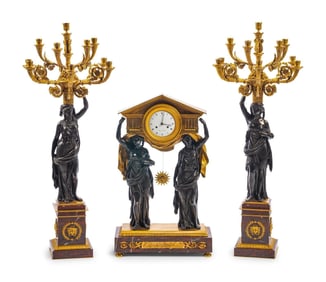 A Large French Gilt and Patinated Bronze and Rouge Marble Three-Piece Clock Garniture