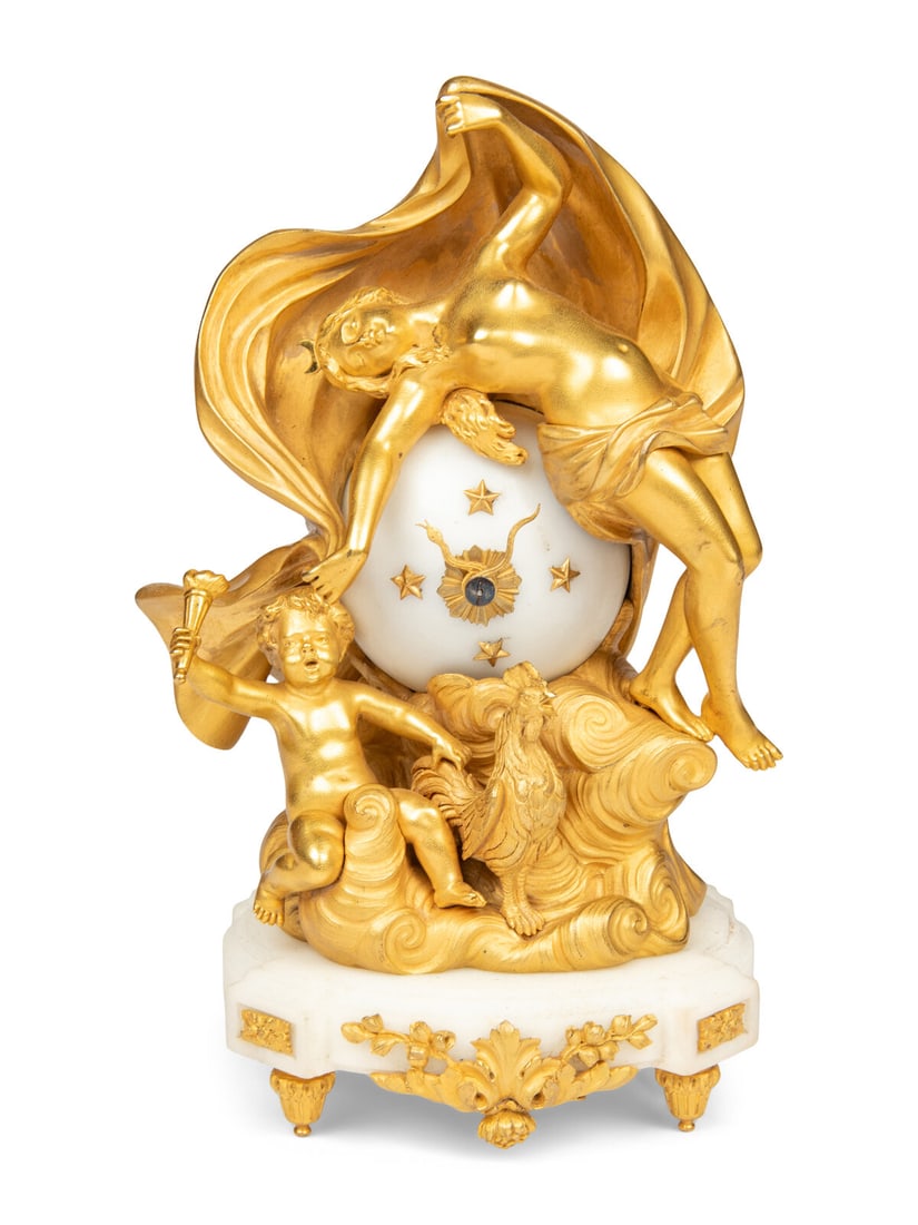 A French Ormolu and Marble Figural Clock: A French Ormolu and Marble Figural Clock Second Half 19th Century the escapement signed with initials "M.B." with a hammer in an oval; together with original leather-bound case with gilt hand tooled t