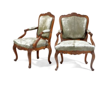 A Pair of Italian Rococo Carved Walnut Armchairs