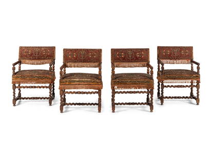 A Set of Four Baroque Revival Walnut Armchairs: A Set of Four Baroque Revival Walnut Armchairs 19th Century and Incorporating Earlier Elements with earlier metallic embroidered upholstery. Height 33 3/4 x width 23 x depth 21 inches. This lot is loc