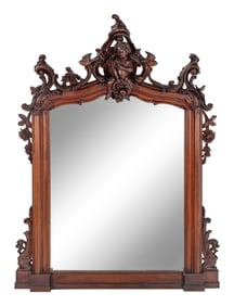 An Italian Rococo Revival Carved Walnut Mirror