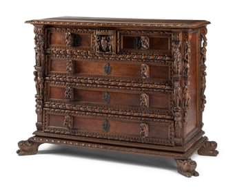 An Italian Renaissance Revival Carved Walnut Chest of Drawers