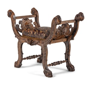An Italian Renaissance Revival Carved Walnut Curule Bench