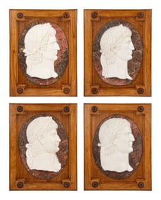 A Set of Four Carved Marble Profile Medallions of Roman Emperors