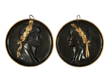 A Pair of Continental Patinated and Parcel Gilt Bronze Plaques of Roman Emperors