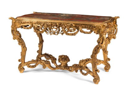 An Italian Carved Giltwood and Chinese Lacquer-Inset Center Table: An Italian Carved Giltwood and Chinese Lacquer-Inset Center Table 20th Century in the Louis XV taste. Height 32 x width 55 x depth 29 inches. This lot is located in Chicago.