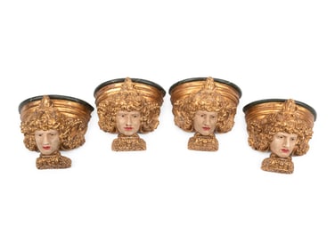 A Set of Four Italian Carved, Painted and Parcel Gilt Wall Brackets
