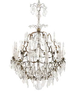 A Continental Brass and Cut Glass Twenty-Light Chandelier: A Continental Brass and Cut Glass Twenty-Light Chandelier 18th Century Height 70 x diameter 45 inches. Property from the Private Collection of Merle Reskin This lot is located in Chicago. Provenance: