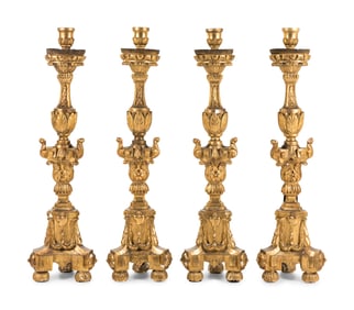 A Set of Four Continental Baroque Style Carved Giltwood Torchères
