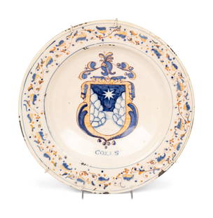 A Dutch Glazed Earthenware Armorial Charger: A Dutch Glazed Earthenware Armorial Charger 17th Century Diameter 17 1/2 inches. Property From the Estate of a Distinguished Philadelphia Gentleman This lot is located in Chicago.
