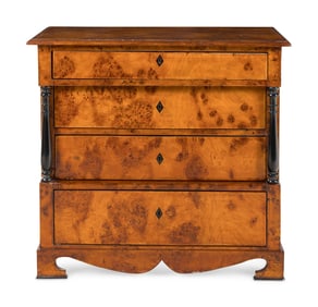 A Biedermeier Part-Ebonized Burlwood Commode