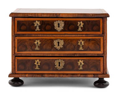 A George I Oysterwood Diminutive Chest of Drawers: A George I Oysterwood Diminutive Chest of Drawers Early 18th Century Height 9 1/2 x width 13 x depth 8 1/2 inches. Property from the Charlecote Antique Store, Kansas City, Missouri This lot is located