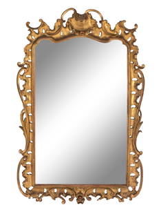 A George III Giltwood Mirror: A George III Giltwood Mirror Hay and Lyall, Early 19th Century bearing a partially obscured label for Hay and Lyall affixed to verso. Height 51 x width 33 inches. Property from the Collection of