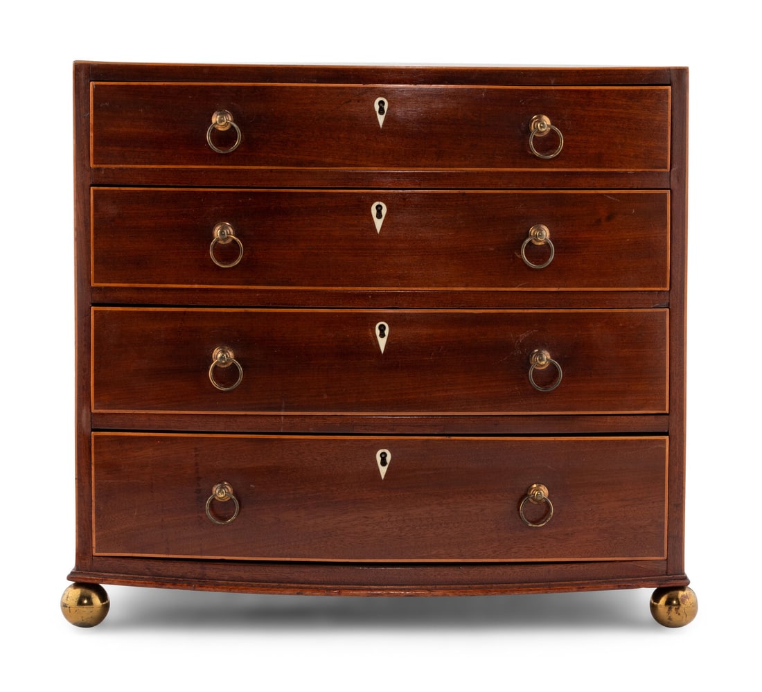 A George III Mahogany Diminutive Chest of Drawers: A George III Mahogany Diminutive Chest of Drawers Circa 1800 Height 16 3/4 x width 18 1/2 x depth 11 inches. Property from the Charlecote Antique Store, Kansas City, Missouri This lot is located in Ch