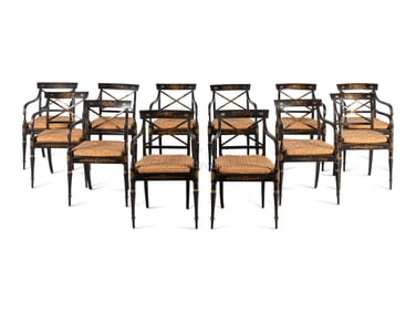 A Set of Twelve Regency Ebonized and Parcel Gilt Dining Chairs