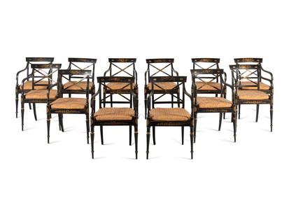 A Set of Twelve Regency Ebonized and Parcel Gilt Dining Chairs: A Set of Twelve Regency Ebonized and Parcel Gilt Dining Chairs Circa 1810 Height 34 x width 21 x depth 21 1/2 inches. This lot is located in Chicago. Provenance: Collection of the Late Honorable C. Do
