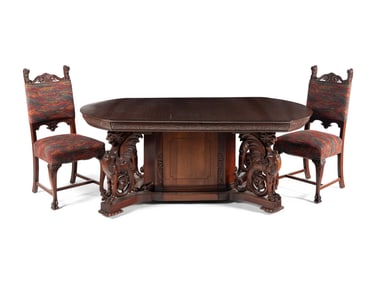 A Renaissance Revival Carved Mahogany Dining Table and Set of Six Chairs