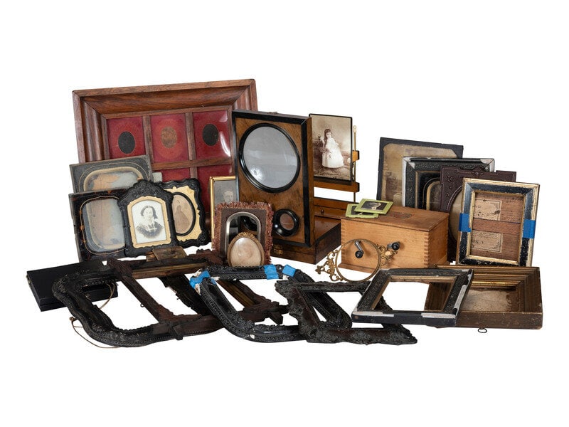 [EARLY PHOTOGRAPHY]. A large assortment of frames, cases, and sundry other accoutrements.: [EARLY PHOTOGRAPHY]. A large assortment of frames, cases, and sundry other accoutrements. 6 3/4 x 10 1/2 x 2 5/8 in. wooden stereoviewer. -- 8 x 4 1/2 x 4 1/4 in. wooden Kodak film tank, with majority