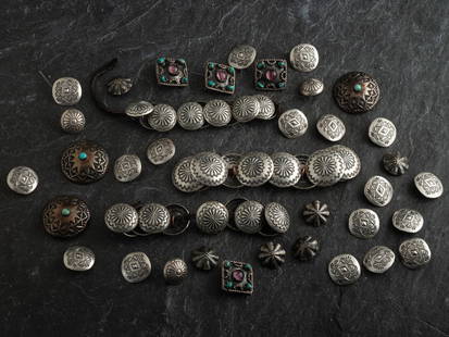 Southwestern Silver Buttons: Southwestern Silver Buttons second half 20th century lot of 43, group of Navajo, Mexican, and Southwestern-style buttons; sizes range from largest diameter 1-1/4 inches to smallest diameter 5/8 inch,