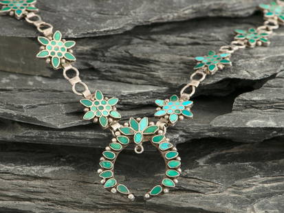 Frank Dishta, Attributed (Zuni, 1902-1954) Dainty Silver Link and Channel Inlay Turquoise Squash: Frank Dishta, Attributed (Zuni, 1902-1954) Dainty Silver Link and Channel Inlay Turquoise Squash Blossom Necklace not marked length 19 inches, naja length 1-3/8 inches x width 1-1/4 inches, weight 21.