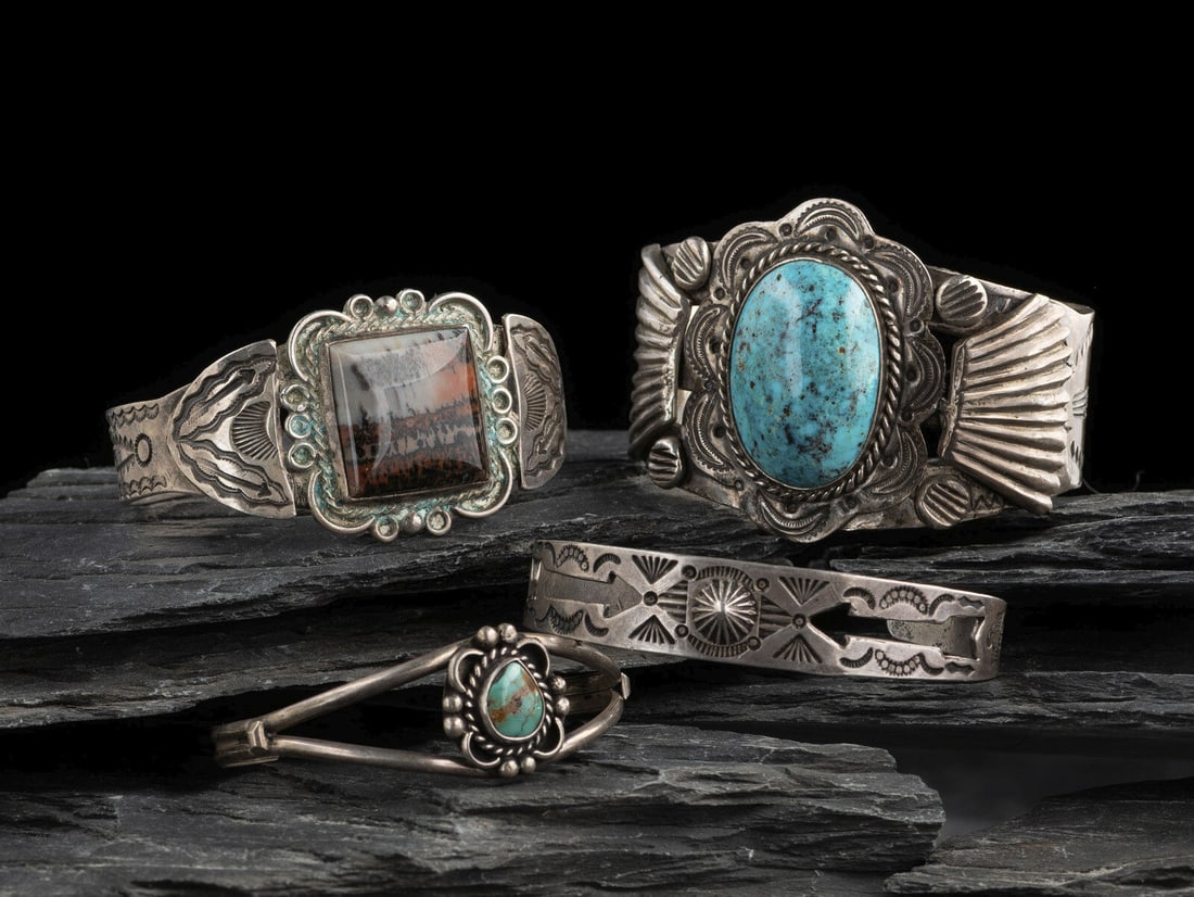 Navajo Cuff Bracelets: Navajo Cuff Bracelets second quarter - mid 20th century lot of 4, includes: a stamped split shank cuff set wth a single turquoise stone; not marked cuff width 1-3/4 inches, interior circumference 5-1/