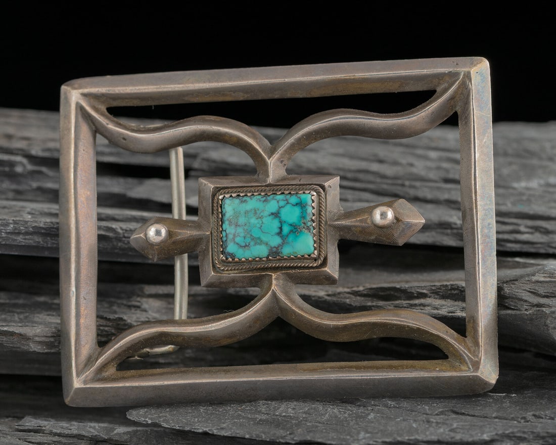 Navajo Sandcast Silver and Turquoise Belt Buckle: Navajo Sandcast Silver and Turquoise Belt Buckle second quarter 20th century was a bolo tie repurposed into a belt buckle; not marked heihgt 2-1/2 inches x length 3-1/4 inches, belt width 1-1/2 inches