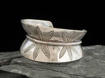 Kenneth Begay (Diné, 1913-1977) Abstract Sterling Silver Cuff Bracelet: Kenneth Begay (Din&#233;, 1913-1977 Abstract Sterling Silver Cuff Bracelet deeply fluted architectural shape with floral design elements; marked STERLING HAND MADE KB and the White Hogan shop mark cuf