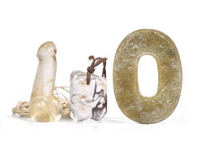 A Rock Crystal "Knucklebone", a Glass Phallus and a Chinese Archaistic Jade Ring: A Rock Crystal "Knucklebone", a Glass Phallus and a Chinese Archaistic Jade Ring The phallus and knucklebone pieced for suspension; the thin oval ring carved with scroll in low relief. Rin