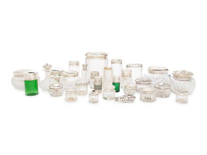 A Collection of Silver Mounted Glass Scent Bottles and Vanity Jars: A Collection of Silver Mounted Glass Scent Bottles and Vanity Jars Various Makers, 19th/20th Centuries Of varying form and size, some variously initialed or monogrammed; total weighable silver approxi