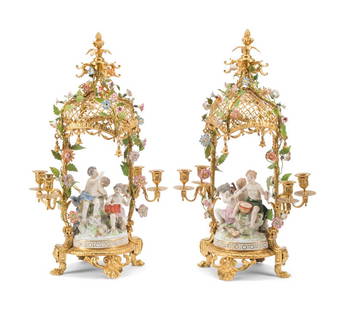 A Pair of French Gilt Bronze and Porcelain Figural Four-Light Candelabra: A Pair of French Gilt Bronze and Porcelain Figural Four-Light Candelabra Late 19th/Early 20th Century Height 27 x width 14 x depth 10 inches. This lot is located in Cincinn