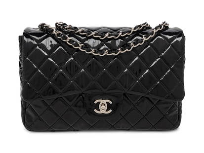 CHANEL, JUMBO PATENT LEATHER CLASSIC FLAP BAG: CHANEL, JUMBO PATENT LEATHER CLASSIC FLAP BAG Jumbo classic flap shoulder bag in quilted black patent leather with silver-tone hardware. CC turn-lock closure and interwoven patent leather-metal chain